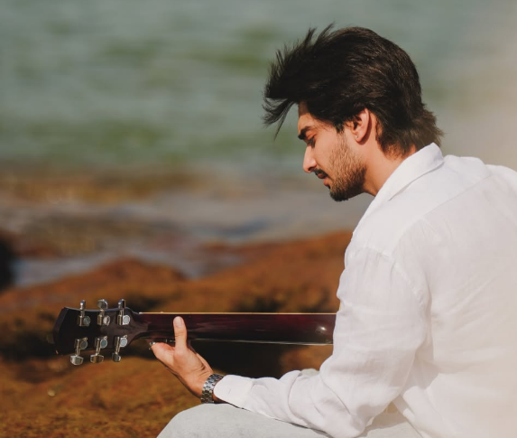 Sheheryar Rehan playing guitar
